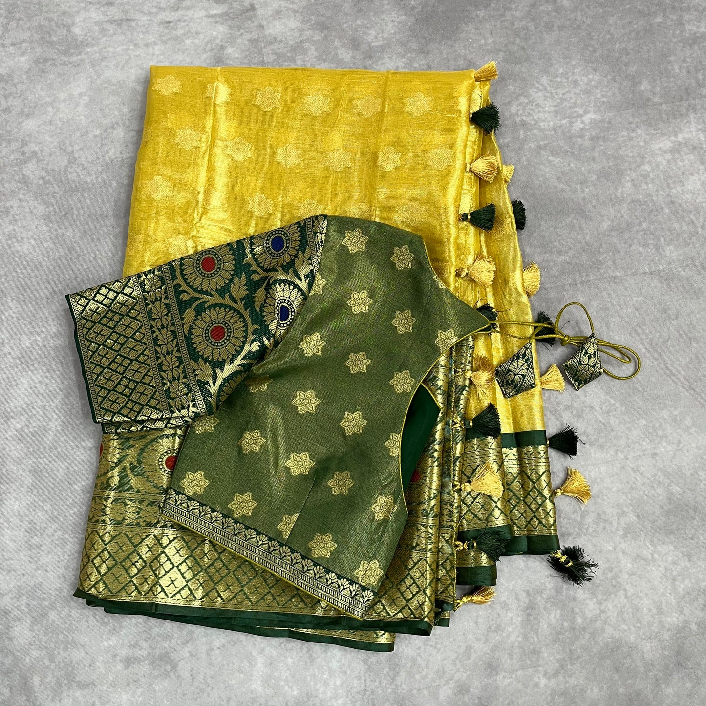 Gold tissue saree / Bottle green stitched blouse