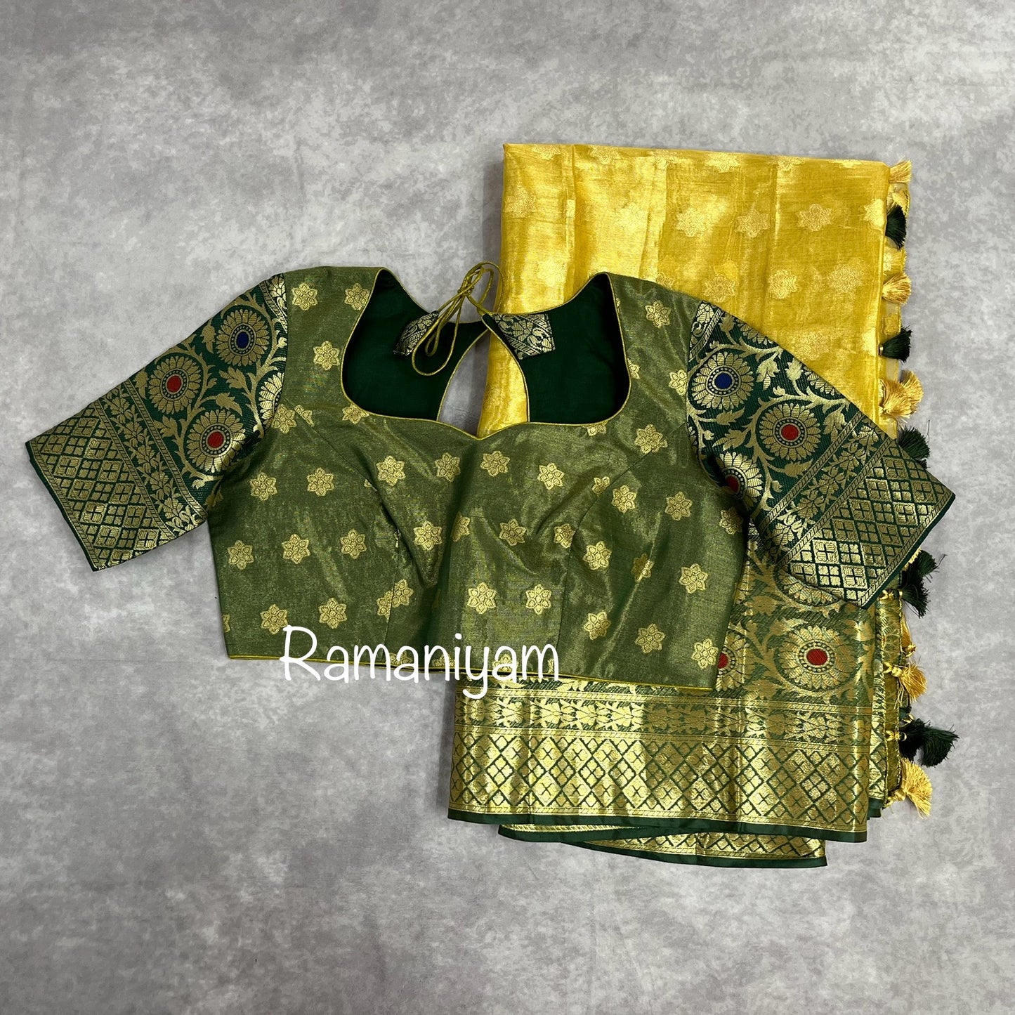 Gold tissue saree / Bottle green stitched blouse