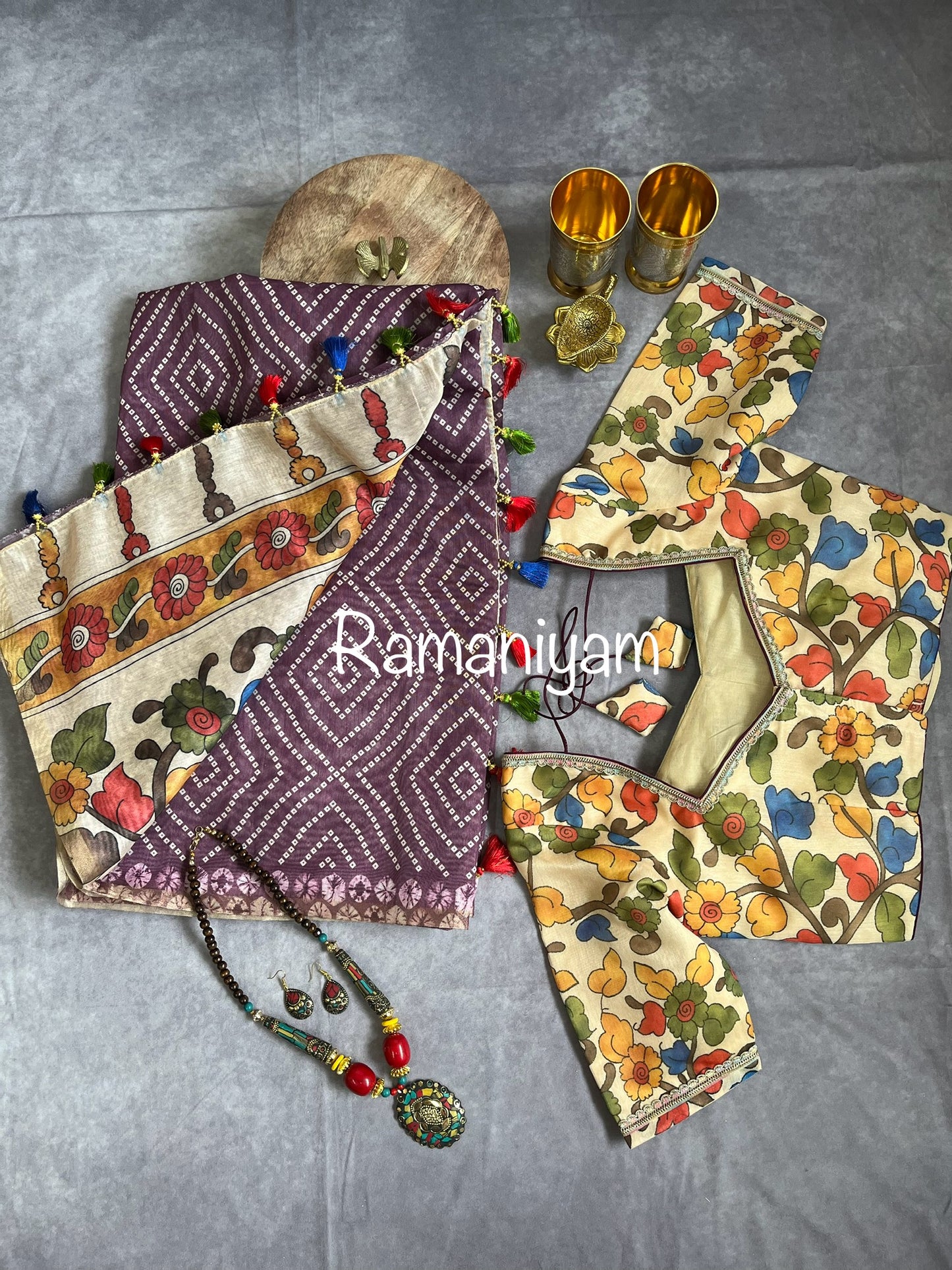 Wine color Organza Bandhani saree with a Kalamkari pallu