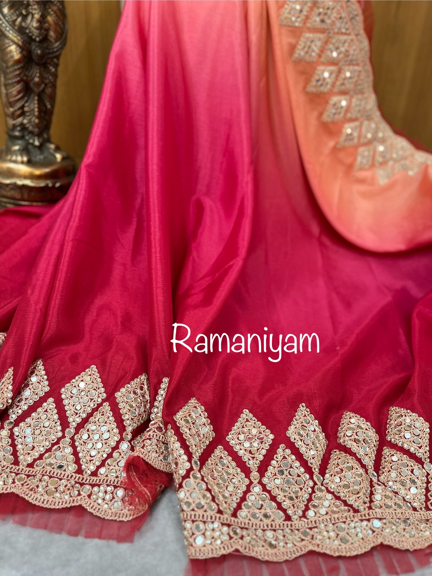 Party wear pink and red shaded crape silk saree embellished with intricate mirror work