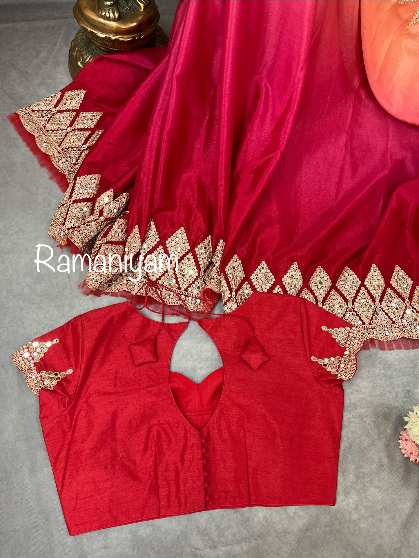 Party wear pink and red shaded crape silk saree embellished with intricate mirror work