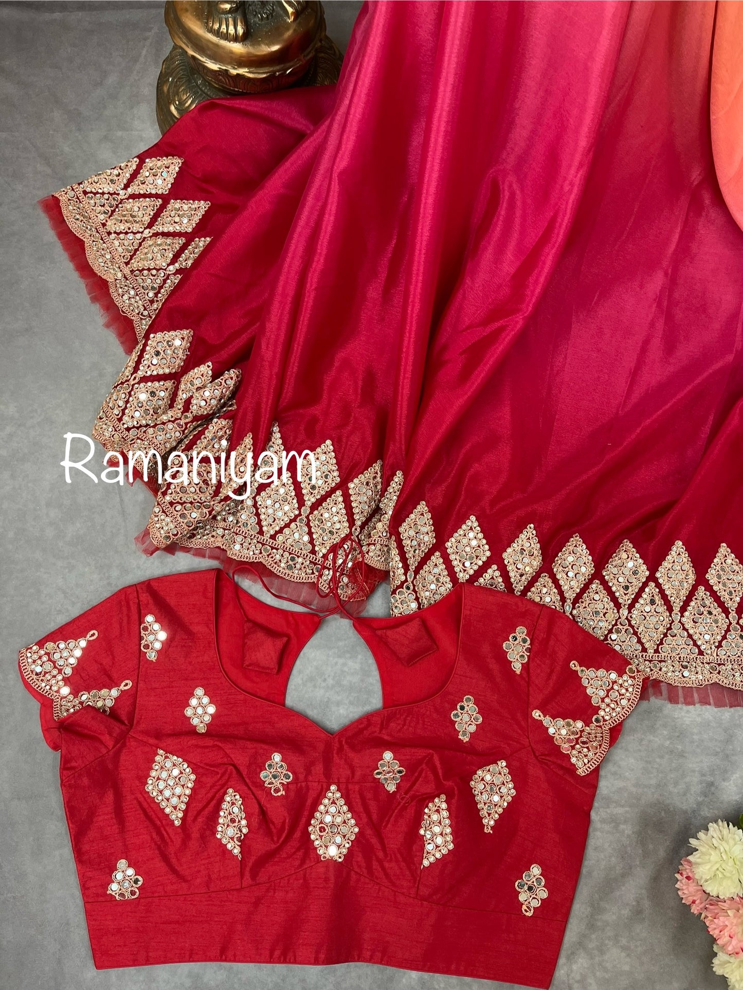 Party wear pink and red shaded crape silk saree embellished with intricate mirror work