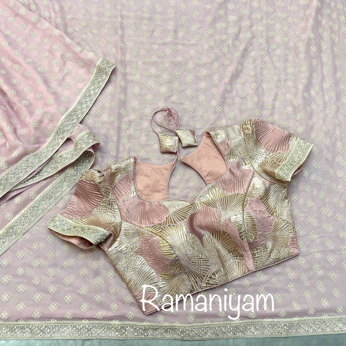 Rose pink tissue georgette saree with stone work borders and metallic rose pink blouse