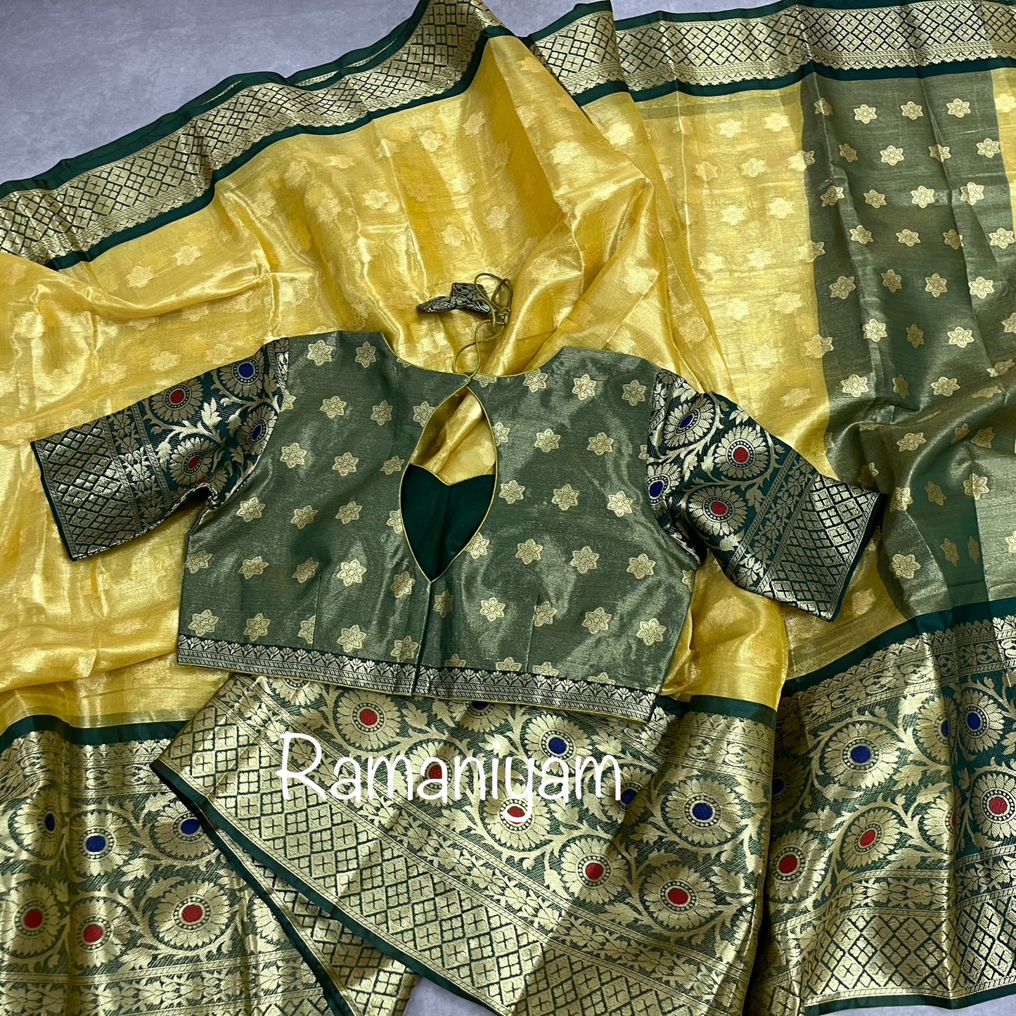 Gold tissue saree / Bottle green stitched blouse