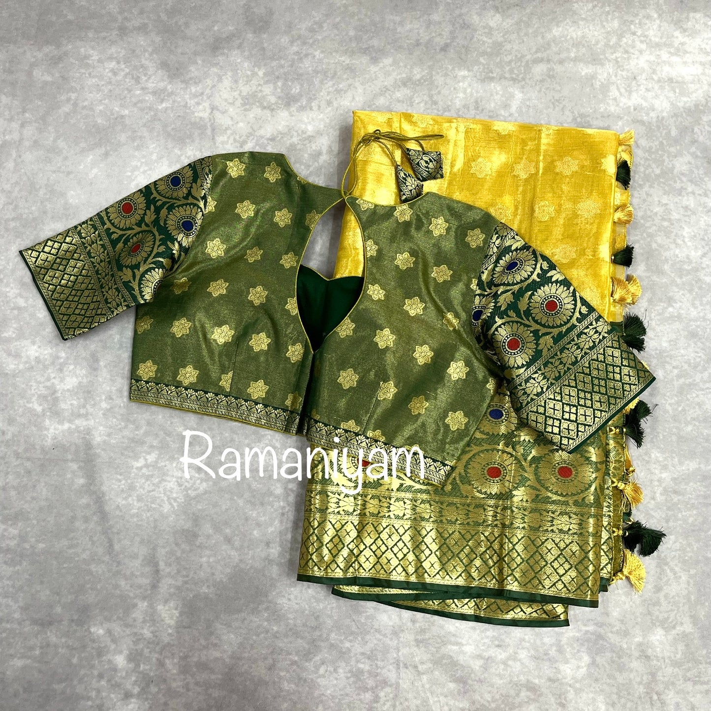 Gold tissue saree / Bottle green stitched blouse