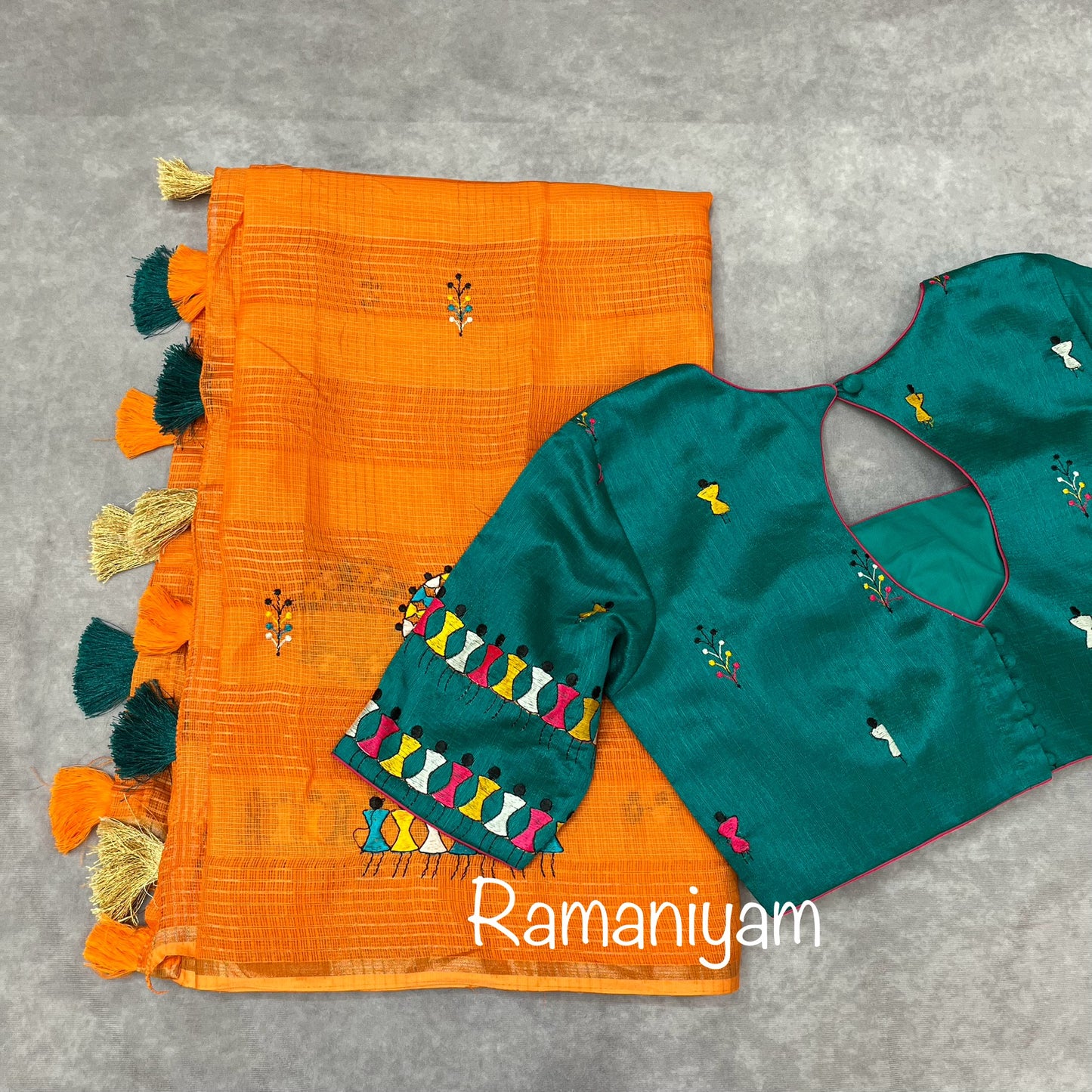 Orange Kota saree with warli embroidery