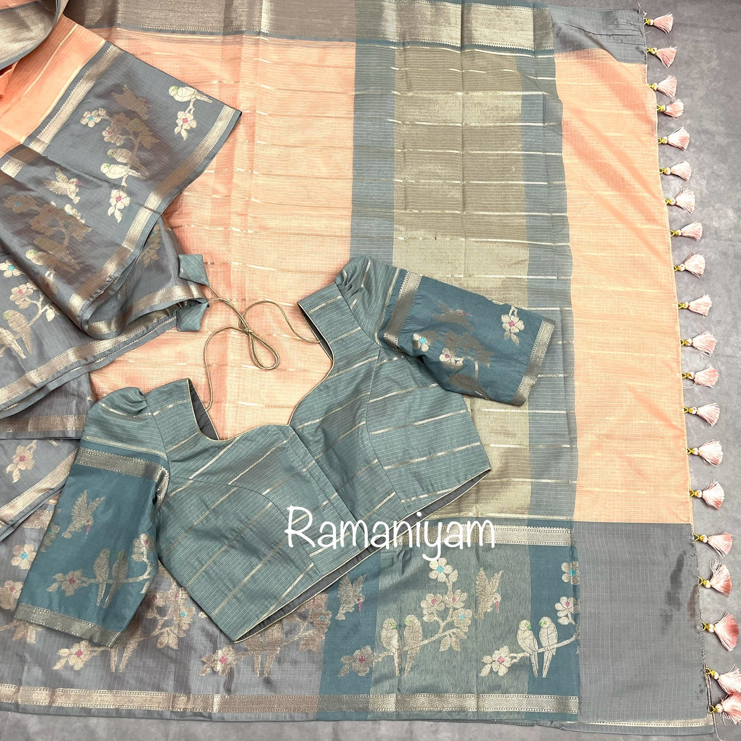 Pastel peach Kota saree with contrast grey border with parrot motifs