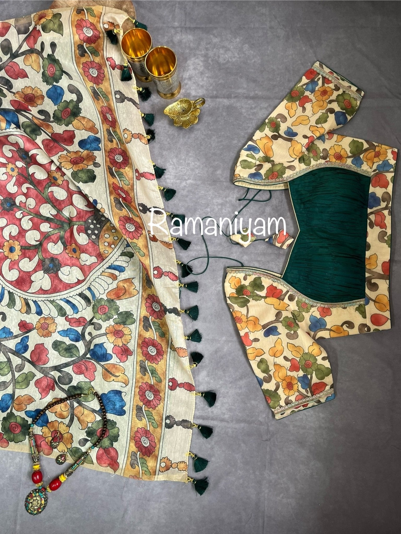 Bottle green Organza Bandhani saree with a Kalamkari pallu - Ramaniyam USA